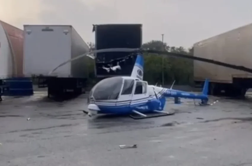  Helicóptero da Band faz pouso forçado e cai próximo à Via Dutra, em Guarulhos